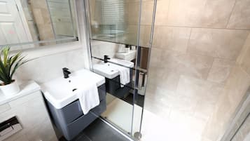 Shower, hair dryer, towels