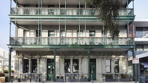 A multi-story building with ornate balconies and a classic architectural style. - Portarlington Grand Hotel (Portarlington)