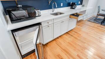 Microwave, coffee/tea maker, toaster, cookware/dishes/utensils