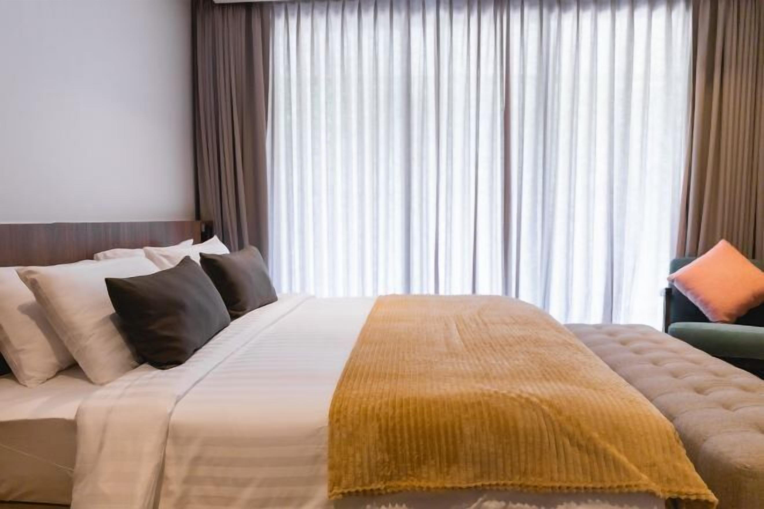 Premium bedding, down duvets, memory-foam beds, in-room safe