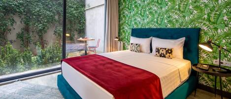 Chambre Deluxe double ou avec lits jumeaux | Literie de qualité, minibar, bureau