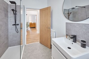 Shower, hair dryer, towels, shampoo