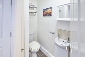 Shower, hair dryer, towels, shampoo