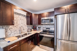 Microwave, coffee/tea maker, cookware/dishes/utensils