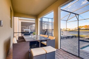Outdoor dining - 2859 BD – Stunning Lakefront Pool Retreat at Storey Lake (Kissimmee)