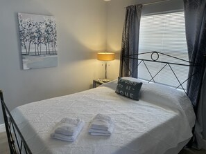 1 bedroom, desk, iron/ironing board, travel cot