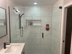 Combined shower/tub, hair dryer, towels, soap