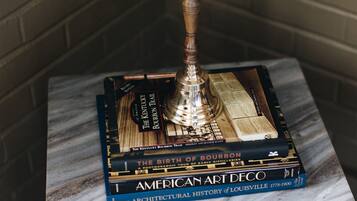 A stack of books on a marble surface.