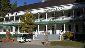 A two-story building with a sign reading "Wawona Hotel". - Yosemite Riverside Retreat - Gorgeous Views! Wood burning Stove! (Wawona)
