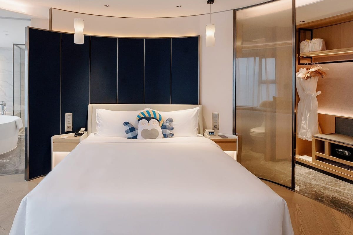 Suite, 1 trĂšs grand lit | 1 chambre, minibar, coffres-forts dans les chambres, rideaux occultants