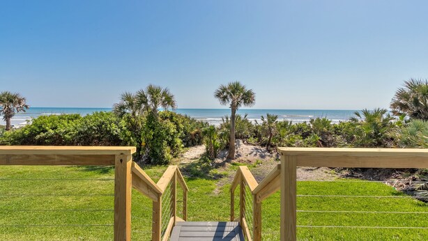 A wooden staircase leading to a beach with palm trees and a clear view of the ocean. - DIRECT OCEANFRONT BEACH HOME! PRIVATE BEACH ACCESS! (New Smyrna Beach)