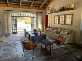 Deluxe Villa | Living area | 42-inch Smart TV with digital channels, TV