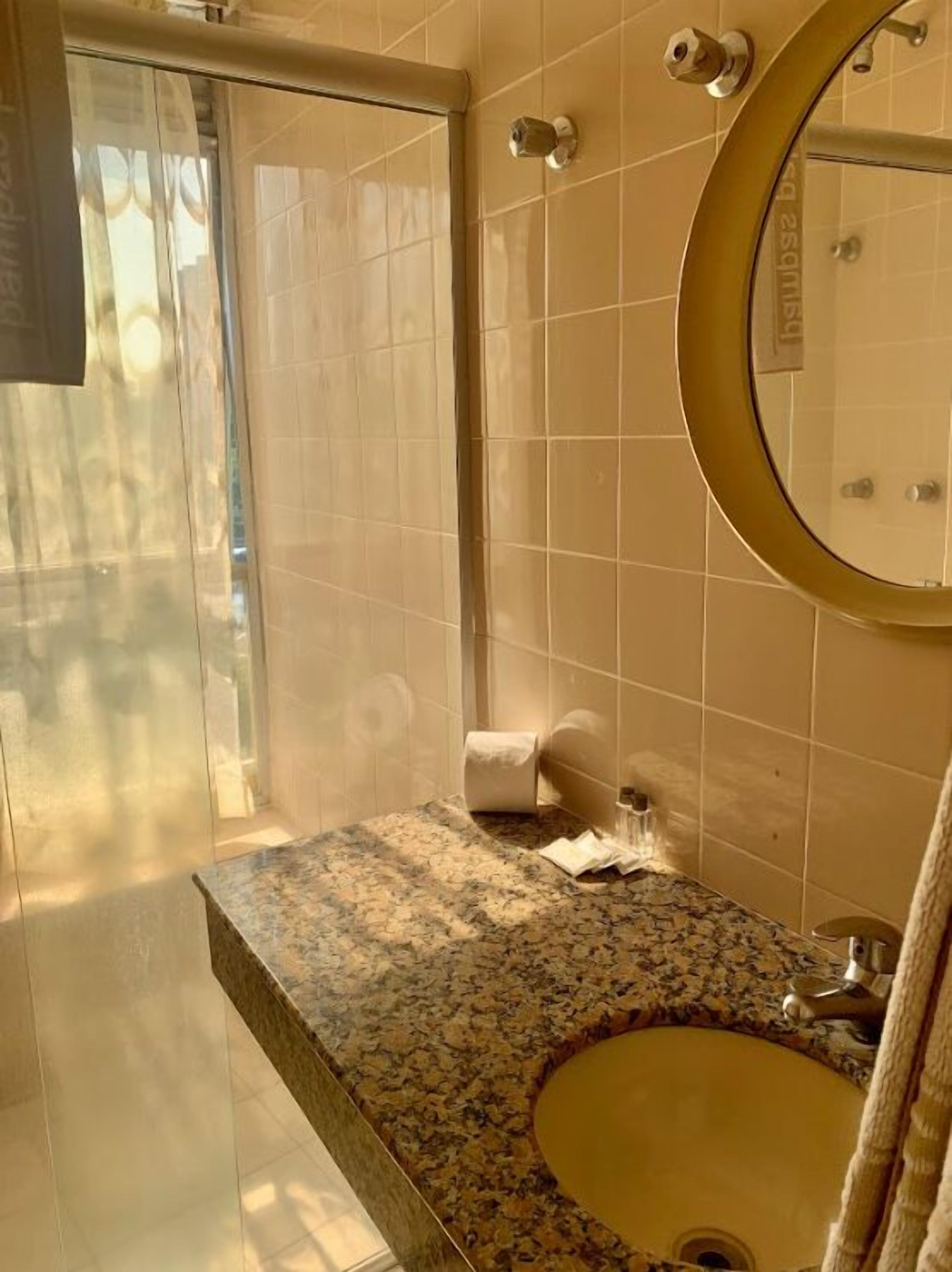 family room, multiple beds | bathroom | towels