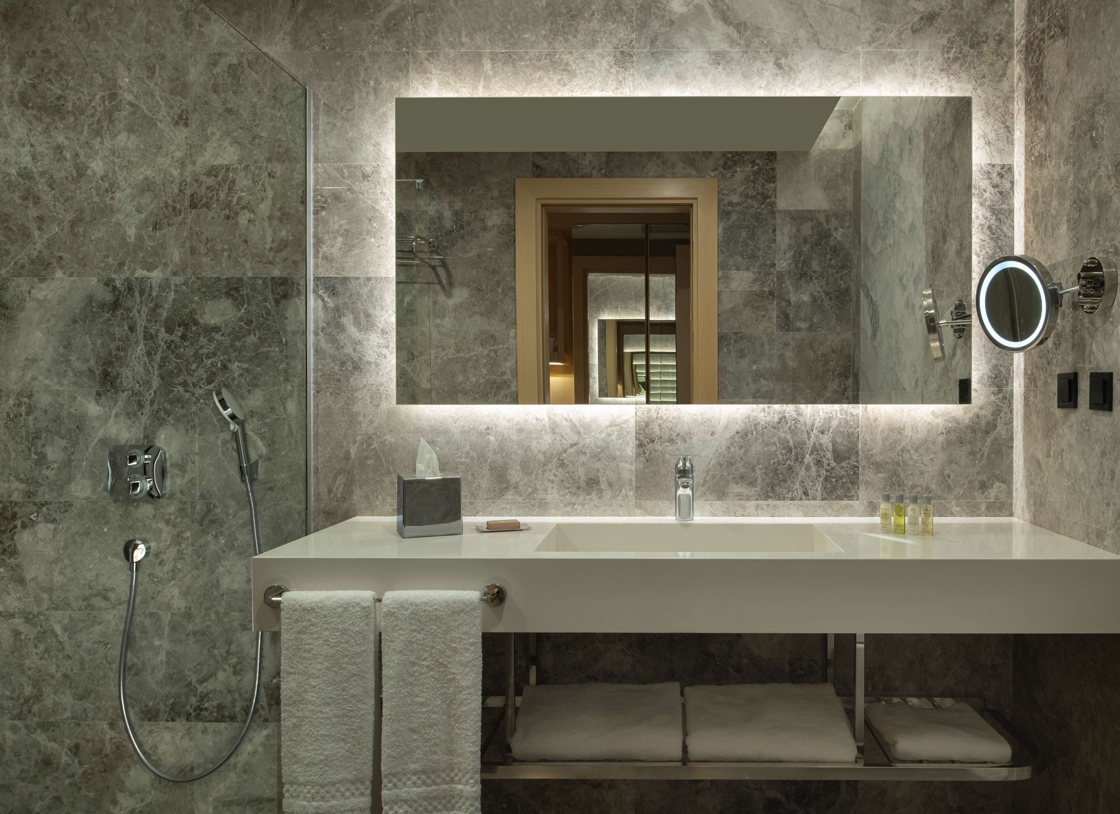 rainfall showerhead, hair dryer, slippers, towels