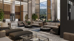 A spacious living area with modern furniture, large windows offering a view of the outdoors, and a mix of seating and tables. - DoubleTree by Hilton Manisa (Manisa)