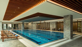 Indoor pool, open 7:00 AM to 11:00 PM, sun loungers