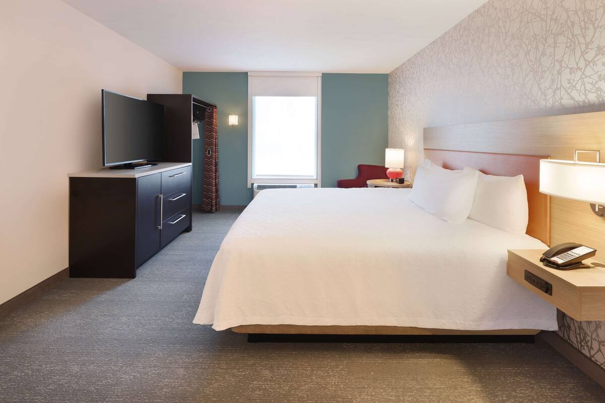 premium bedding, desk, laptop workspace, blackout curtains