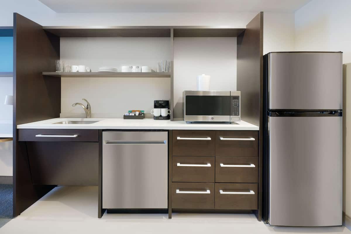 full-sized fridge, microwave, stovetop, dishwasher