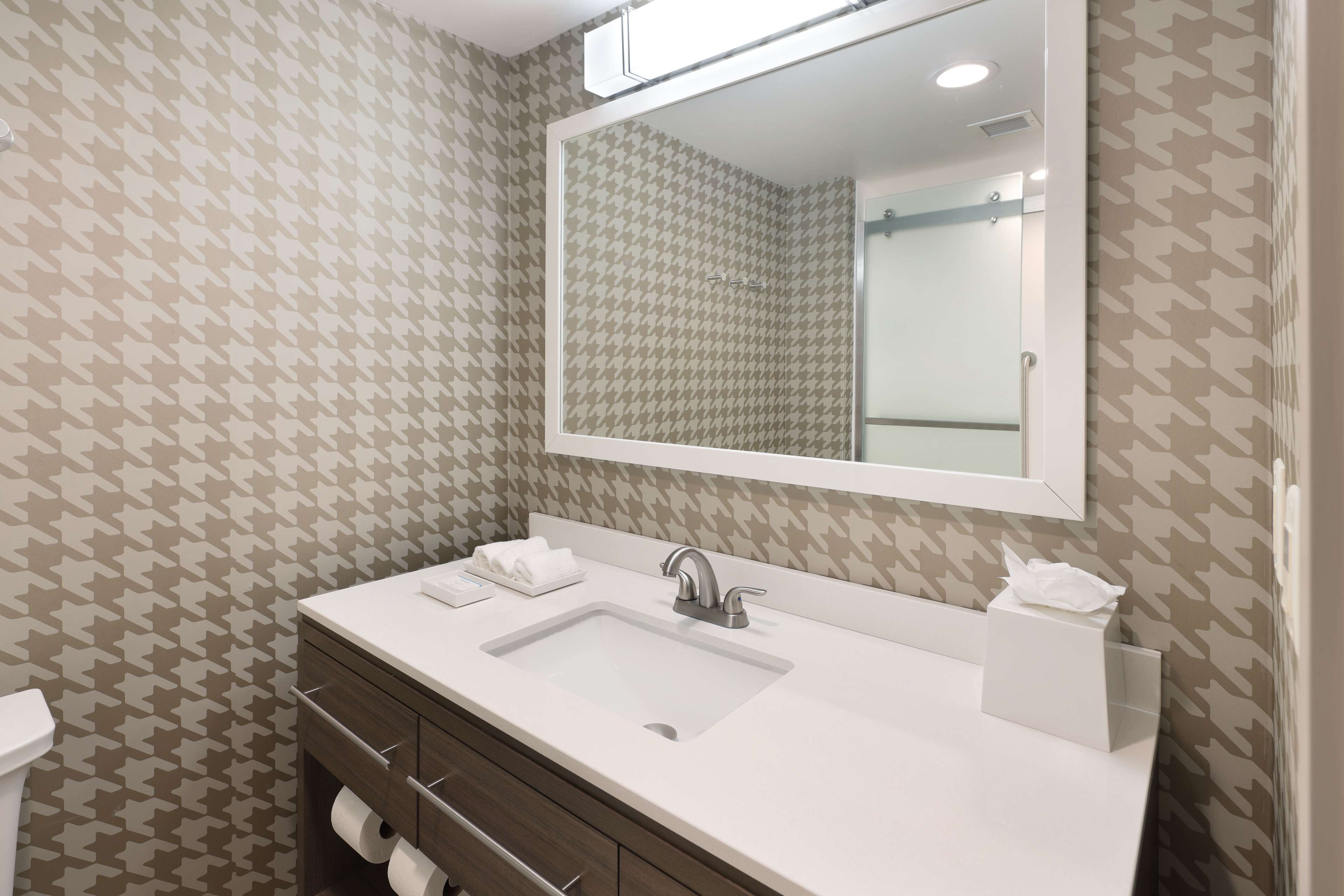 designer toiletries, hair dryer, towels, soap