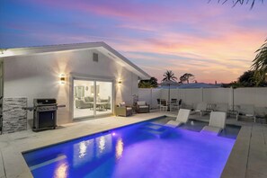 A heated pool, pool loungers