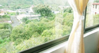 Casa Vacacional Baños white blue house