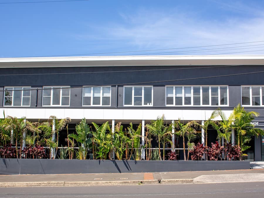 A modern building with a flat roof, large windows, and a sign that reads "CIRCLE".