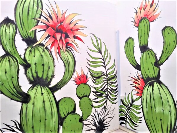 A wall with a cactus and plant illustration. - Zone Hotel Ipoh (Ipoh)