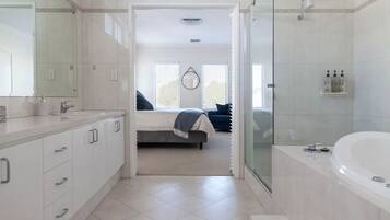 Bathtub, jetted bath, hair dryer, towels
