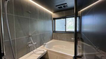 Separate tub and shower, jetted tub, rainfall showerhead
