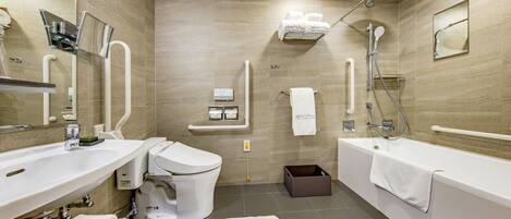A modern bathroom with a sink, toilet, bathtub, and shower.