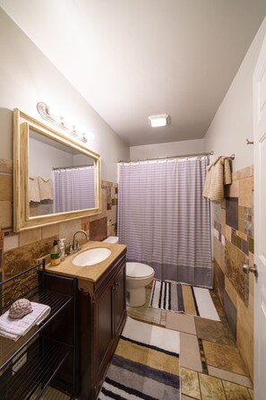 Combined shower/tub, hair dryer, towels, soap - {Sunnyside Wilds} An Ideal Spot for Exploring Asheboro (Asheboro)
