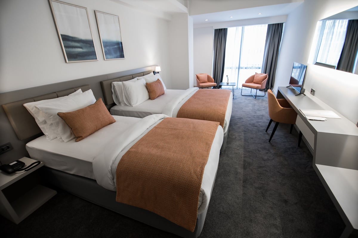 comfort triple room | premium bedding, minibar, desk, laptop workspace