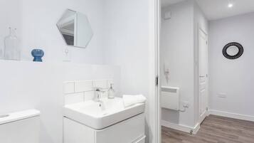 Bathtub, hair dryer, towels