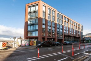 A modern building with a brick facade and large windows.