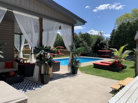Outdoor pool. Suburban Oasis with Private Pool, Jacuzzi & Gym!