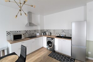 Microwave, coffee/tea maker, cookware/dishes/utensils