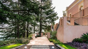 A pathway leading to a building with a stone facade and a staircase. - Luxury pool villa between Taormina and Catania, Sicily (Mascali)