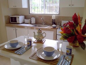 Enjoy a homey dining experience with a fully equipped kitchen and comfortable dining area.