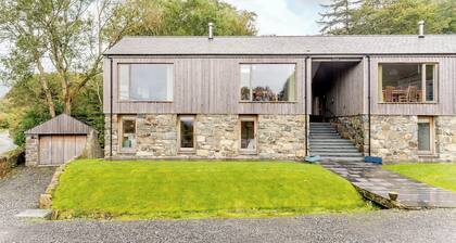 This striking home is ideally located between the beach and the hills.