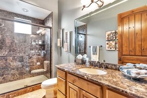 Combined shower/bathtub, hair dryer, towels, soap