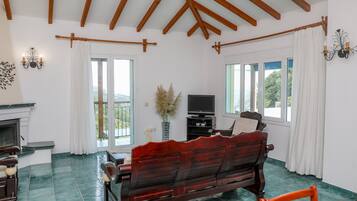 Villa (EVANTHIA) | Living area | 42-inch flat-screen TV with satellite channels, TV