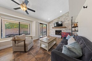 Smart TV, fireplace, table football, books