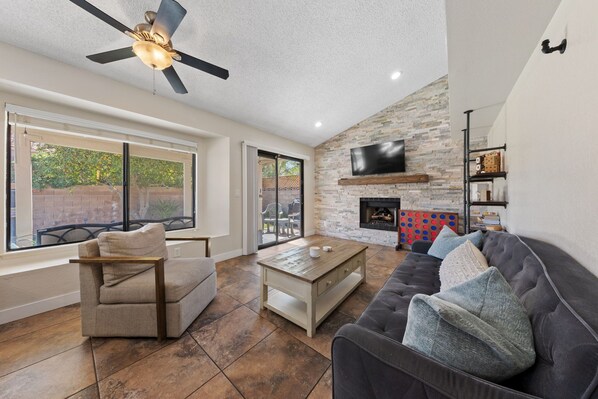 Smart TV, fireplace, table football, books