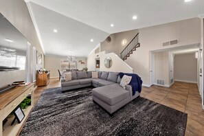 Smart TV, fireplace, table football, books