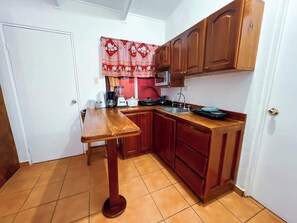 Fridge, microwave, stovetop, coffee/tea maker