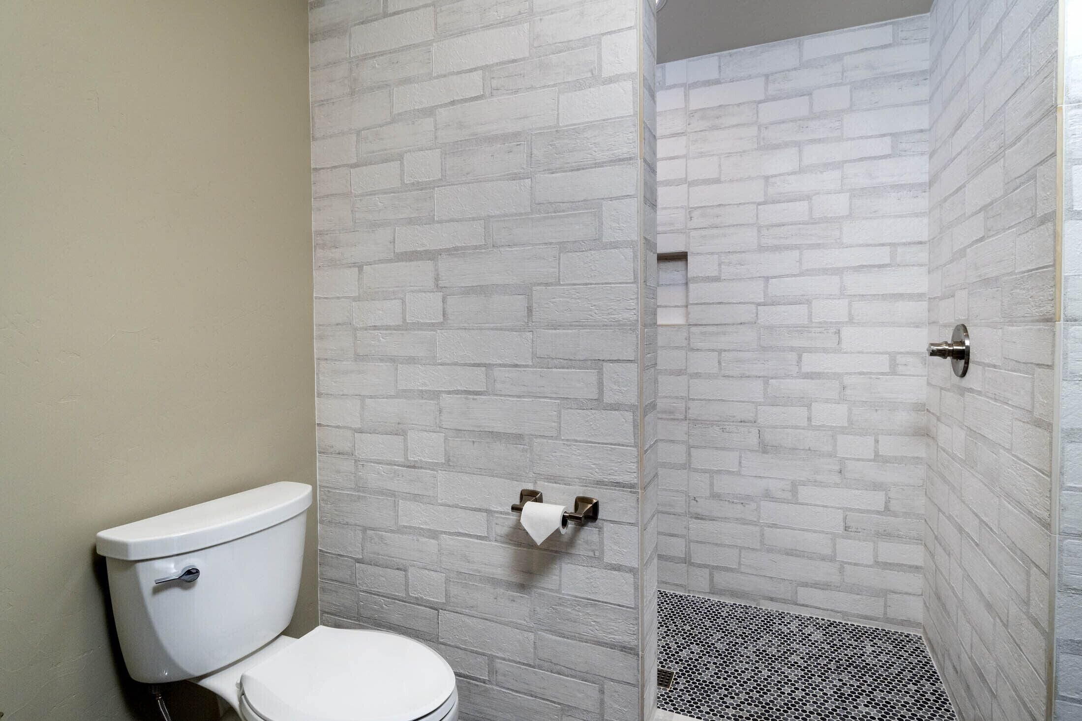 room | bathroom | hair dryer, towels, soap, shampoo