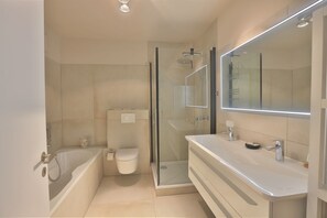 Shower, hair dryer, towels, soap