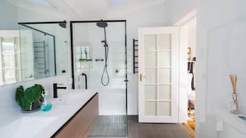 Separate bathtub and shower, towels