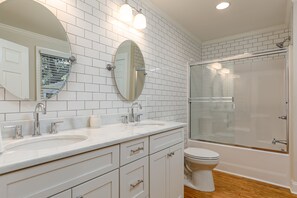 Combined shower/bathtub, hair dryer, towels, soap