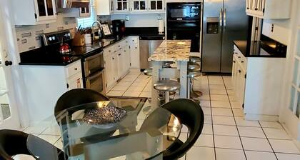Large custom home with pool centrally located to beaches, parks, and family fun.